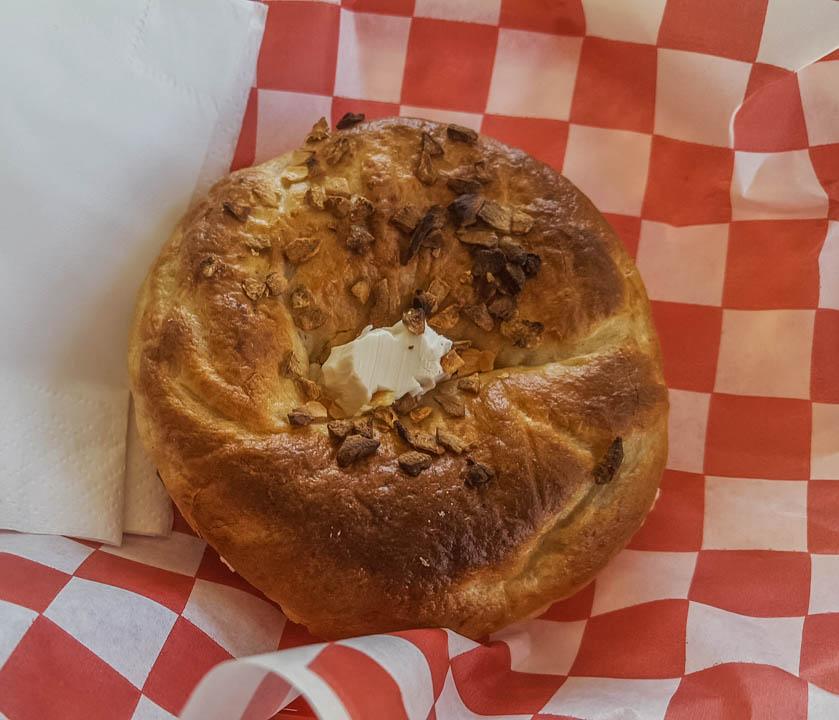 A handmade bagel, toasted with cream cheese