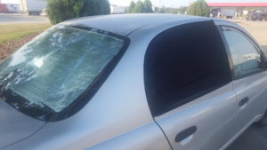 A photo of the outside of our car, showing the rear passenger window covers, and the rear window cover
