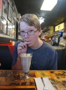 Seth enjoying his milkshake