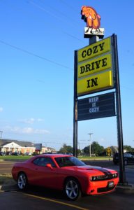 Cozy Drive In sign with a corvette