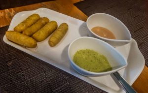 Taquenos (battered cheese sticks) with 2 sauces for dipping