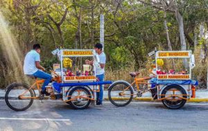 Two marquesita carts with vendors taking a break