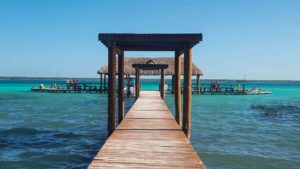 A dock on the bright blue water in Bacalar Lagoon, Quintana Roo