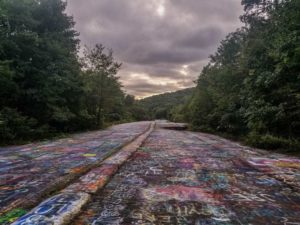Image of graffiti highway of Centralia with gloomy clouds above